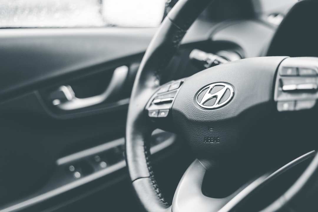 black and gray nissan steering wheel