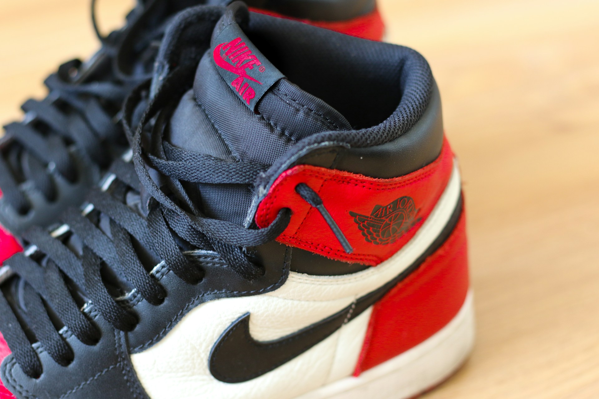 black white and red nike athletic shoe