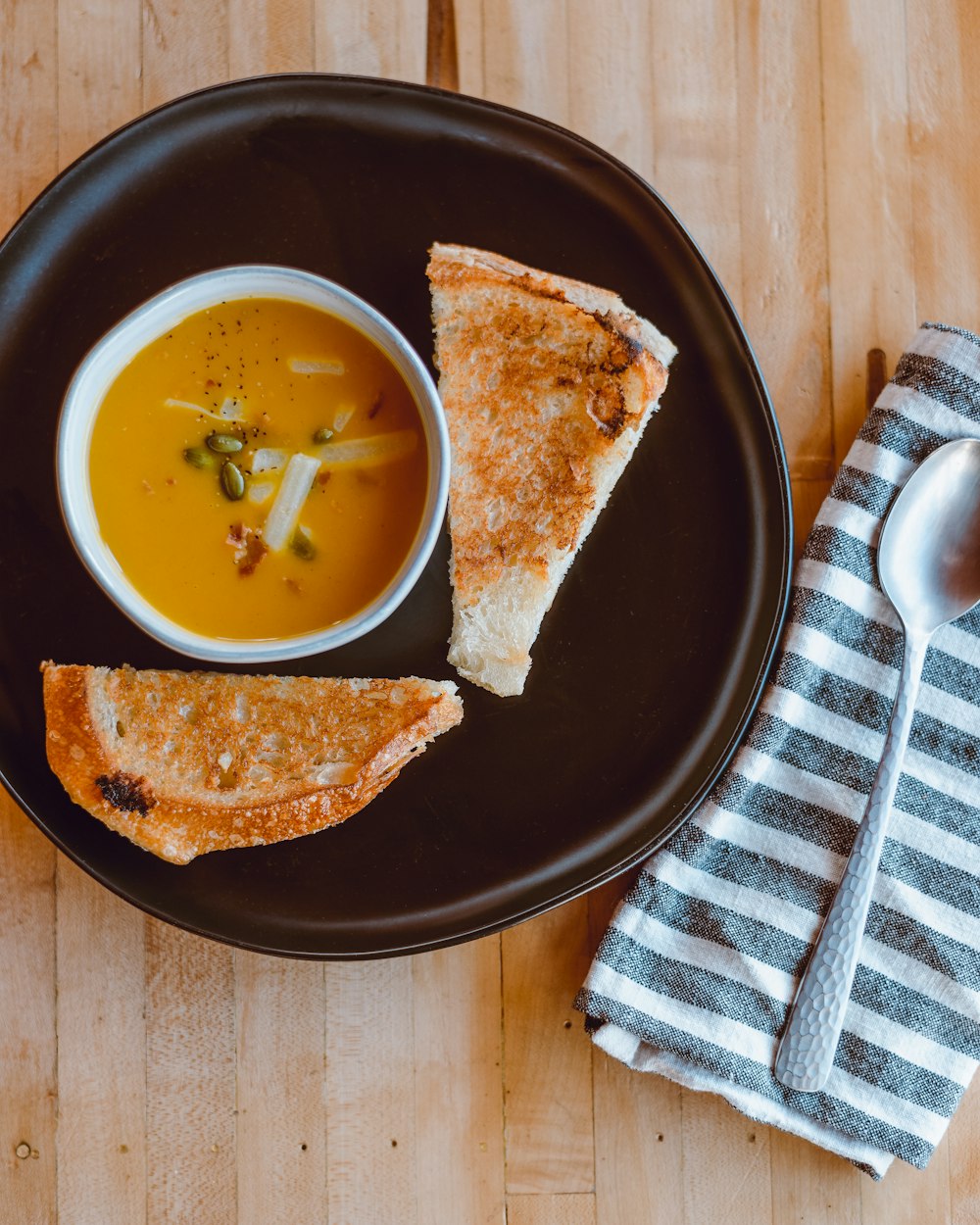 bread with cheese on black plate