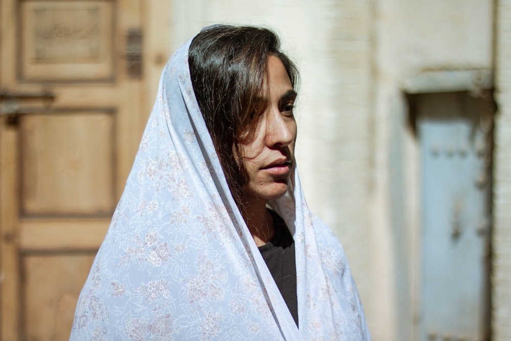 woman in white floral hijab