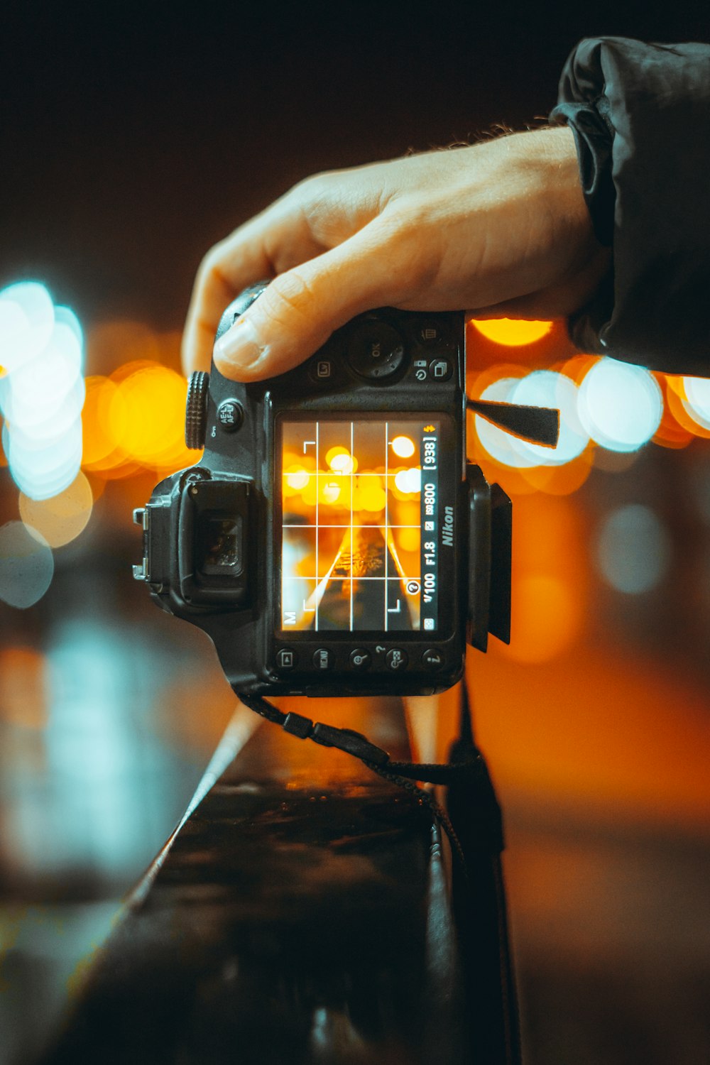 person holding black dslr camera