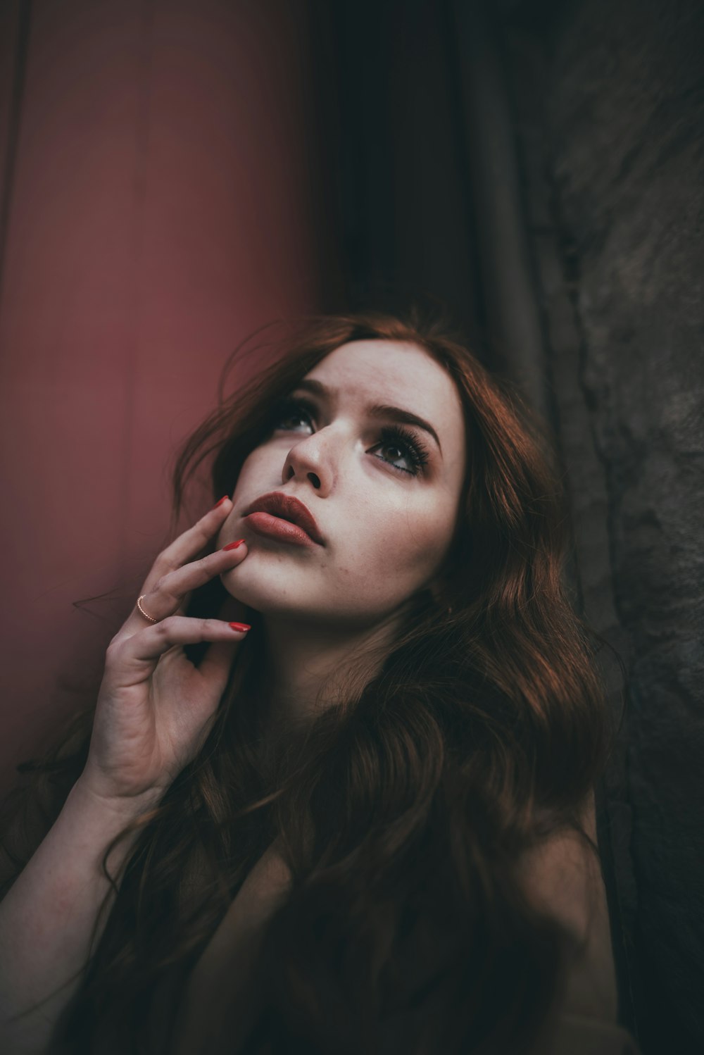 woman with red lipstick and black mascara