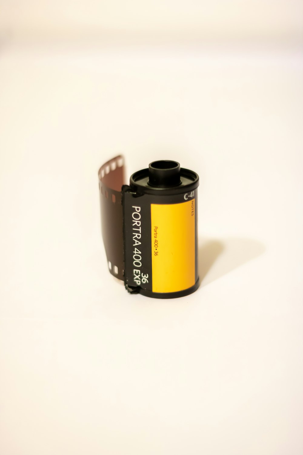 black and yellow labeled can