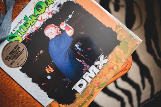 A vinyl album cover featuring a performer with a microphone against a dark background. The text includes 'Smoke Out' in large, colorful letters with additional branding, and the artist's name 'DMX' prominently displayed.