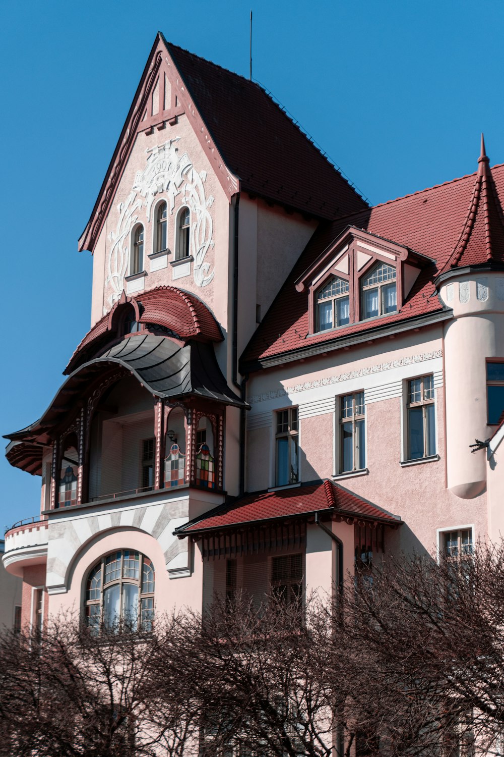 white and red concrete building under blue sky during daytime