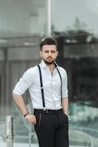 man in white crew neck t-shirt and black pants