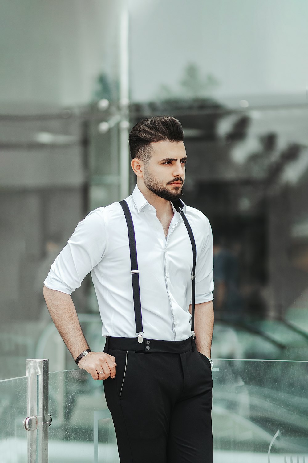 man in white crew neck t-shirt and black pants