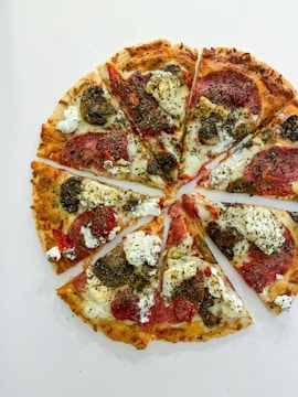 Illustration showing fractions as parts of a pizza divided into slices.