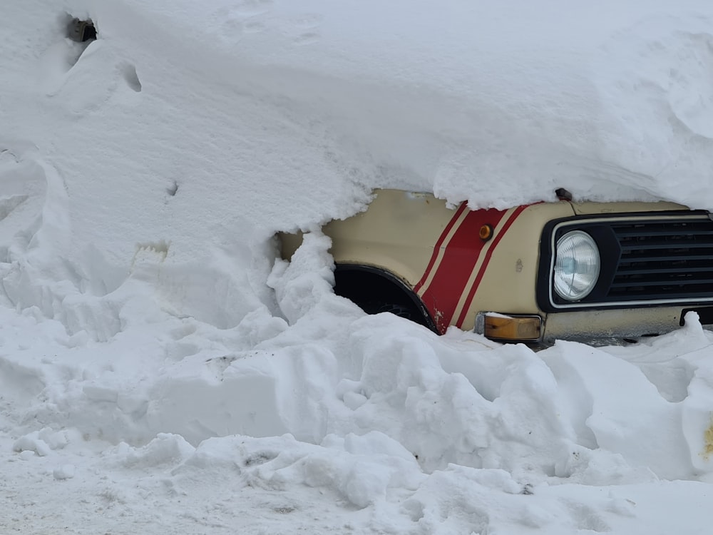 yellow car on snow covered ground during daytime