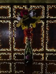 A sparkling 3D floral resin sticker with glitter accents displayed on a water bottle.