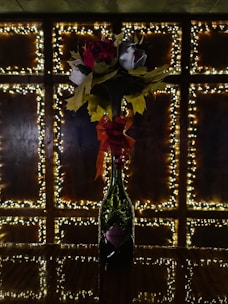 A sparkling 3D floral resin sticker with glitter accents displayed on a water bottle.