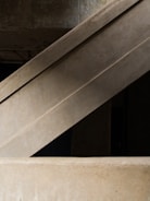 Concrete architectural structures with geometric lines and a modern aesthetic.