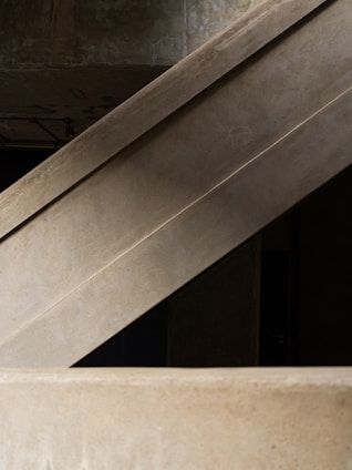 Concrete architectural structures with geometric lines and a modern aesthetic.