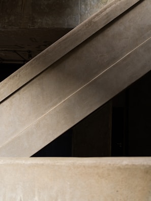 Concrete architectural structures with geometric lines and a modern aesthetic.