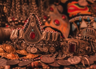 gold and red crown on brown wooden table