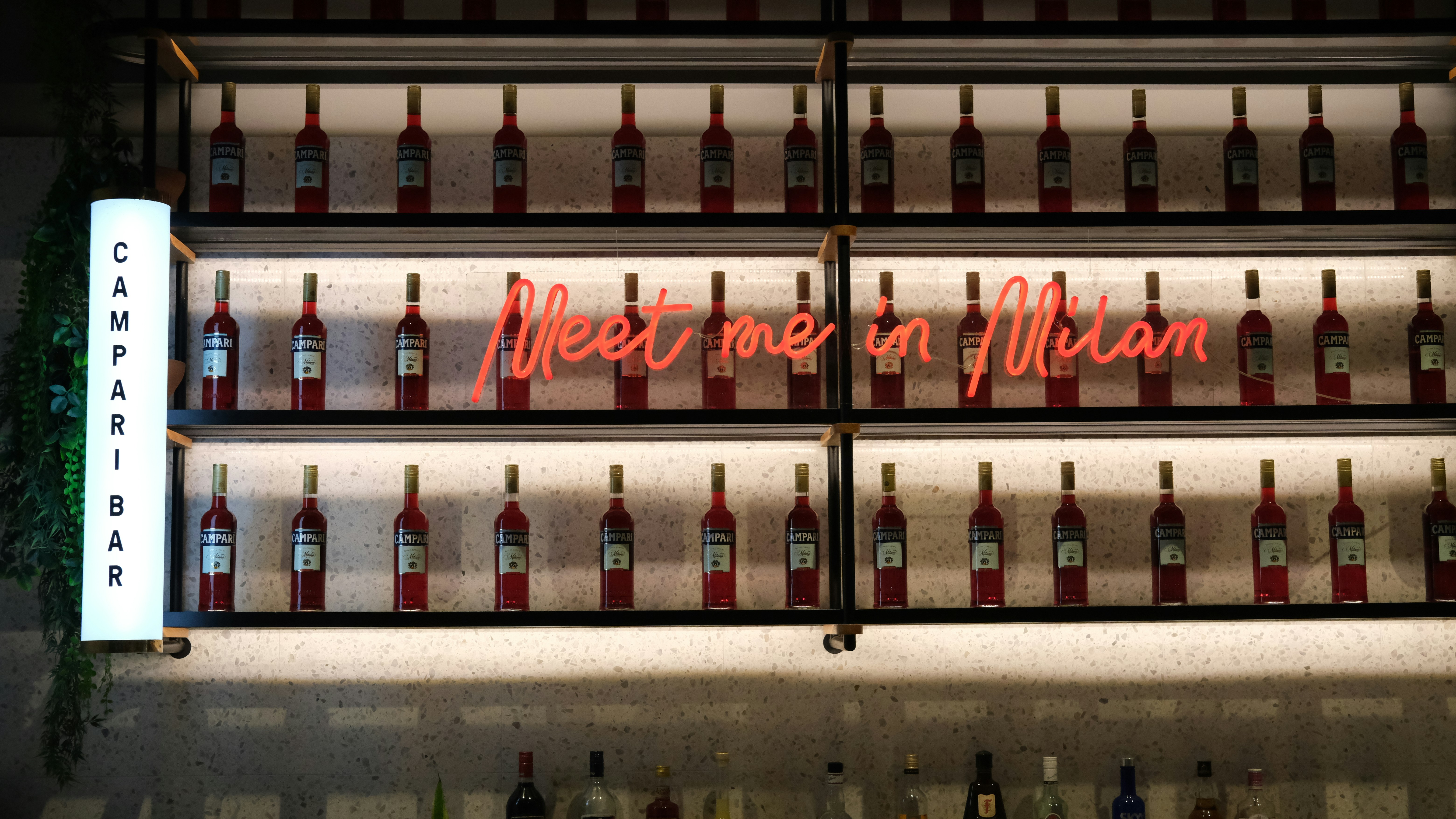 coca cola bottles on white shelf