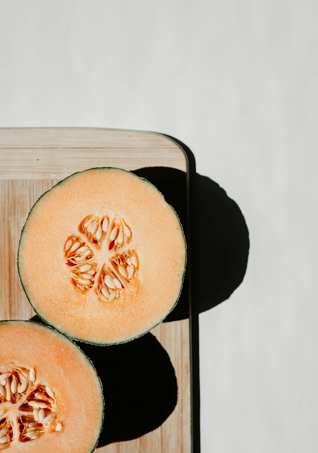 sliced watermelon on black tray