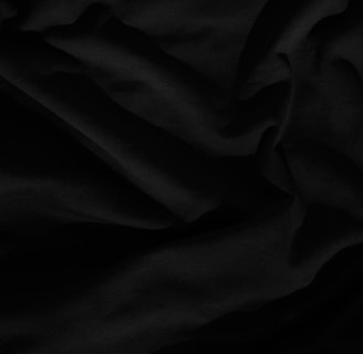 black textile on white textile