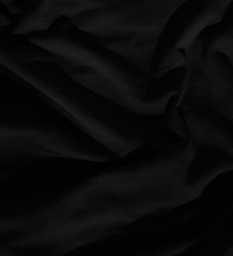 black textile on white textile