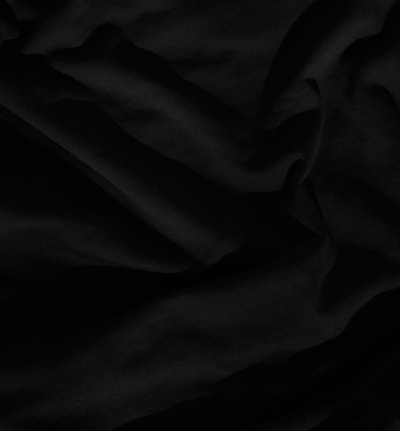 black textile on white textile