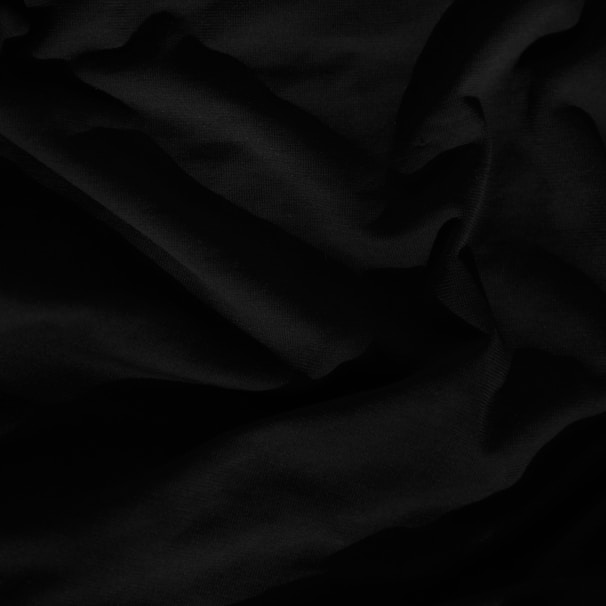 black textile on white textile