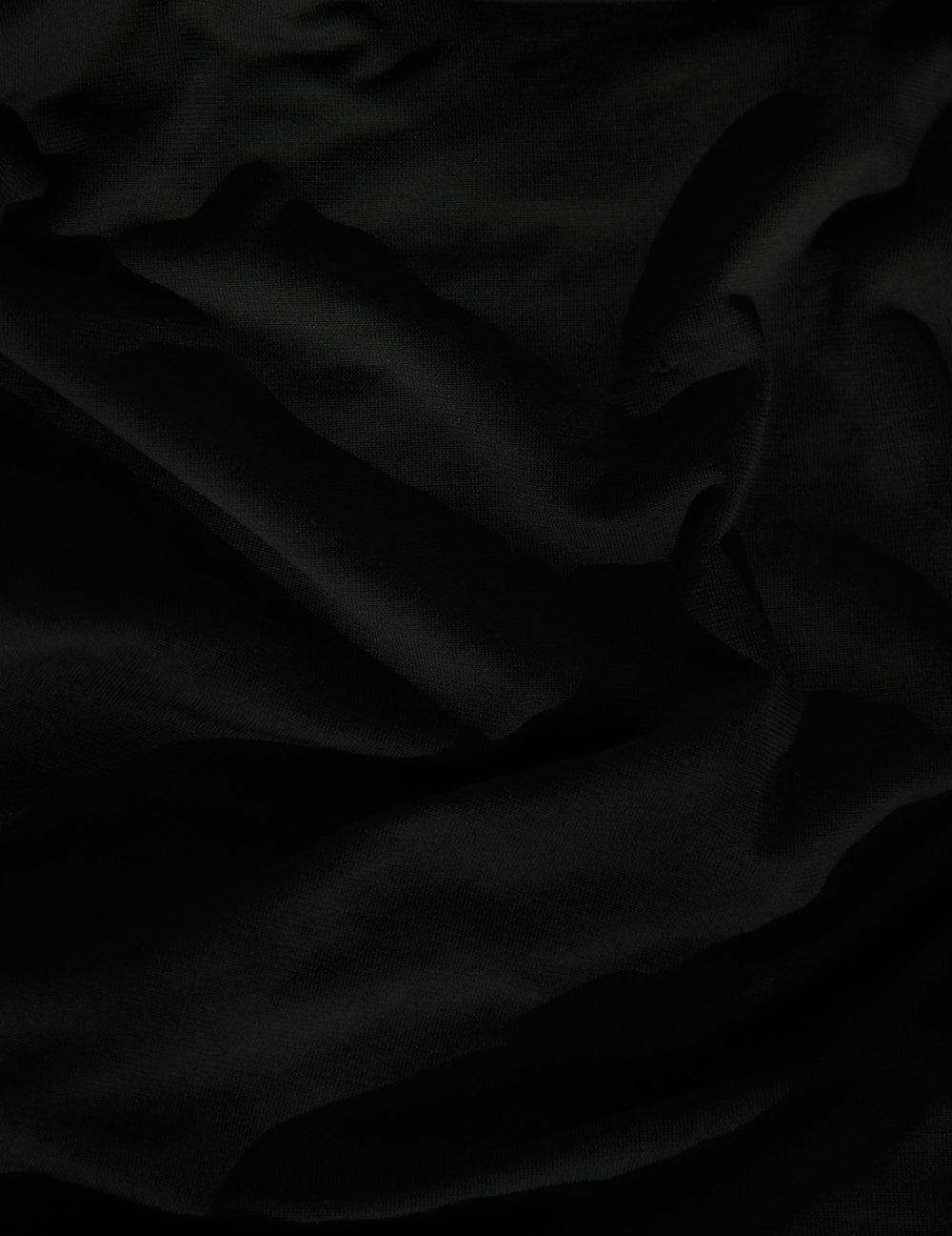 black textile on white textile