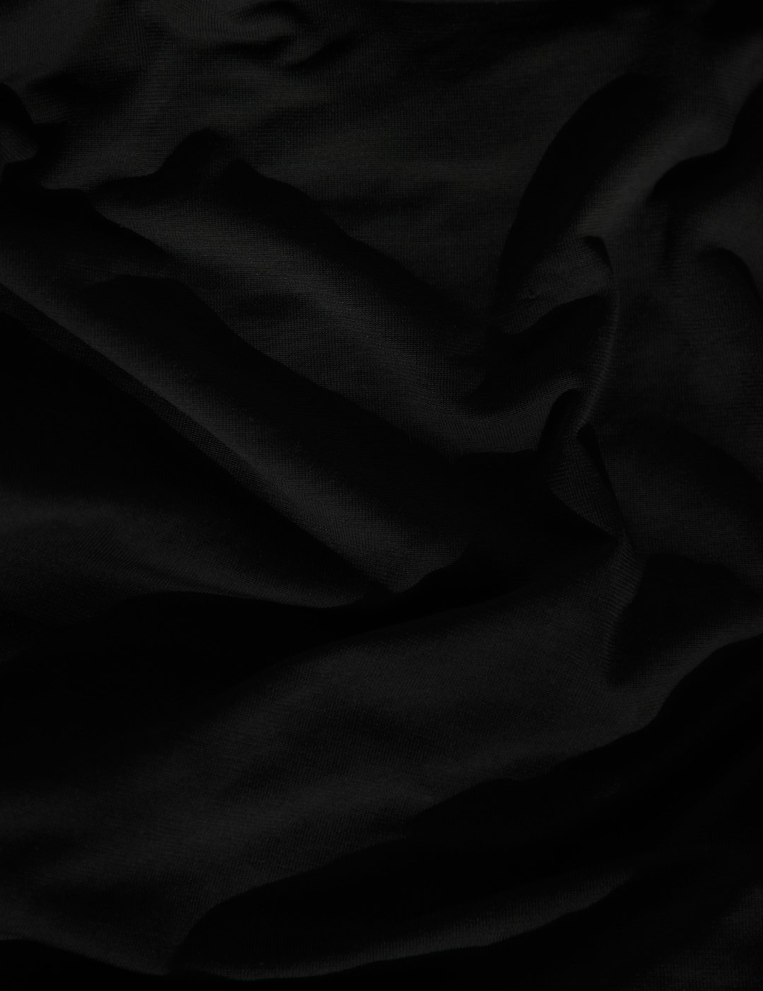 black textile on white textile