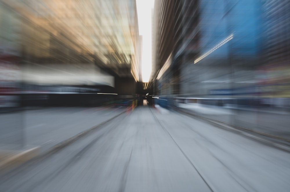 time lapse photography of car on road during daytime