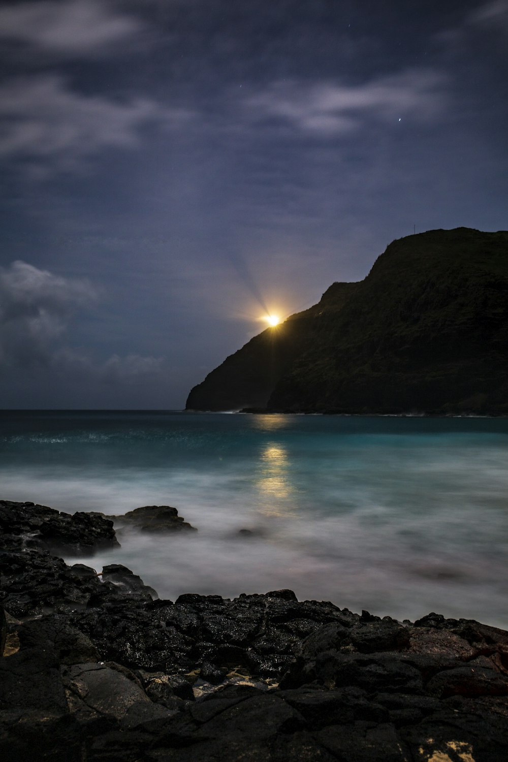 sea waves crashing on shore during sunset