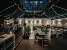 Cozy dining area in Tropicana 218 Macalister with stylish lighting and easy access to local eateries.