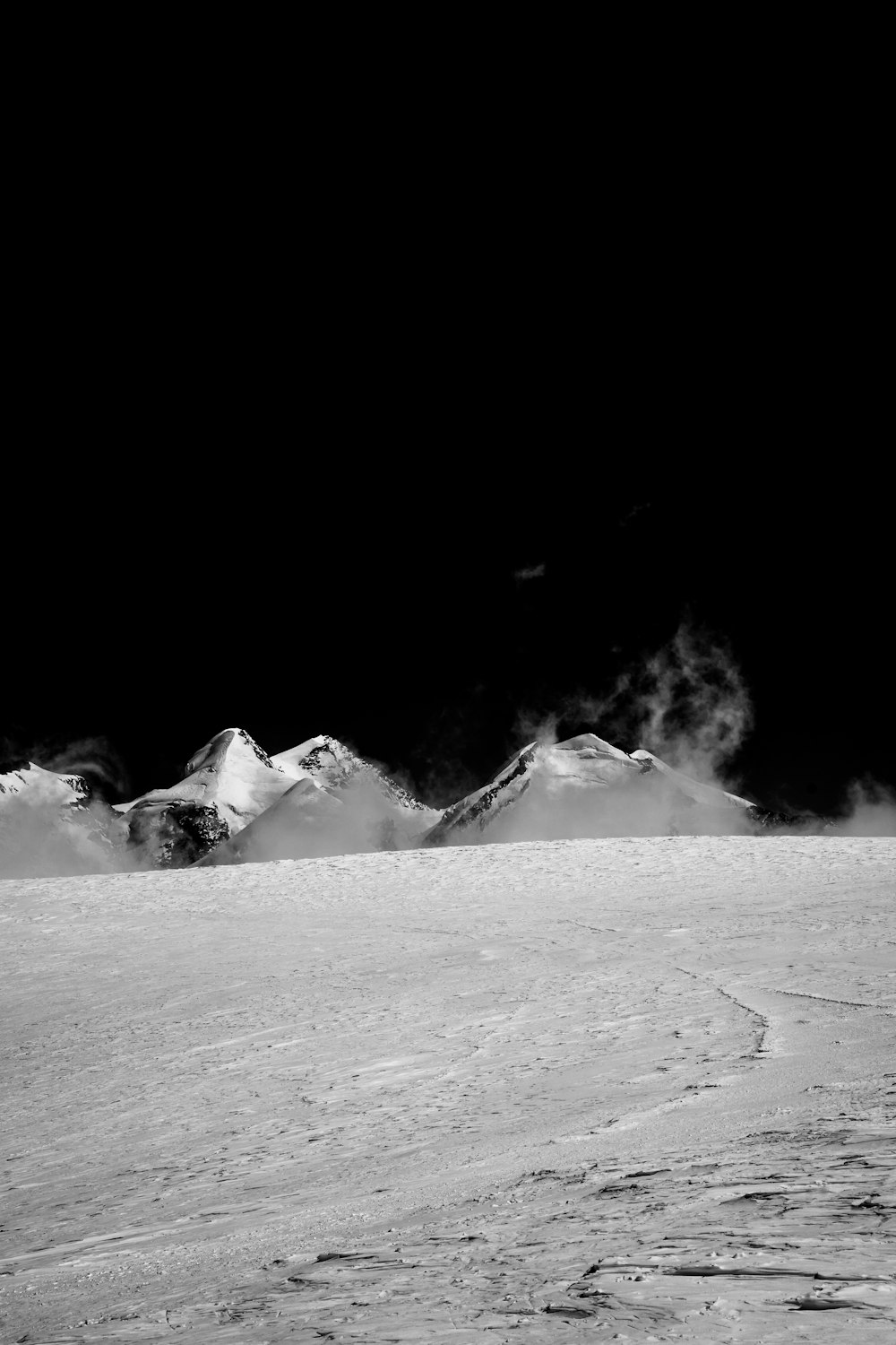 grayscale photo of snow covered mountain