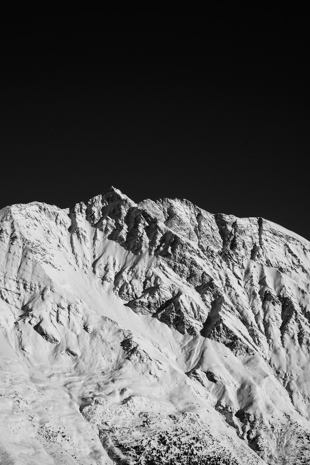 grayscale photo of snow covered mountain