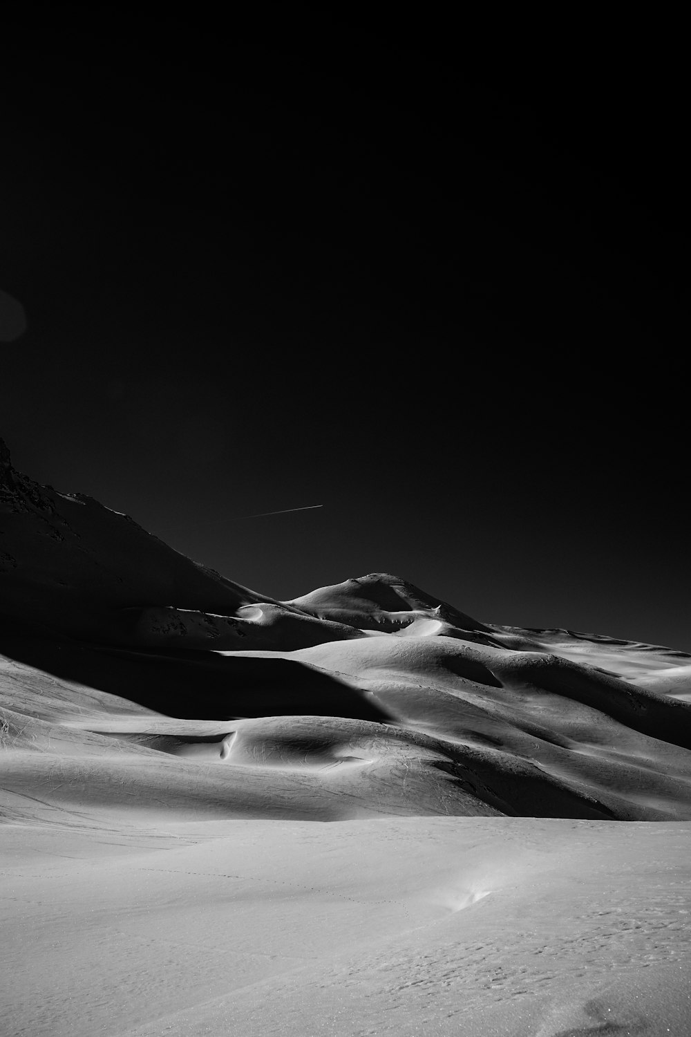 grayscale photo of desert during daytime