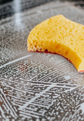 yellow powder on clear glass bowl