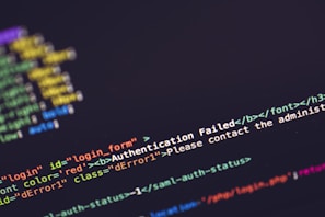 A close-up view of computer code on a screen with a focus on an error message in HTML format. The error message 'Authentication Failed' is highlighted in a bold red font, emphasizing its importance. The screen displays a mix of HTML code syntax, including elements, attributes, and comments.