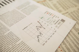 financial newspaper with stock chart