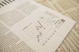 A close-up of financial reports and graphs.