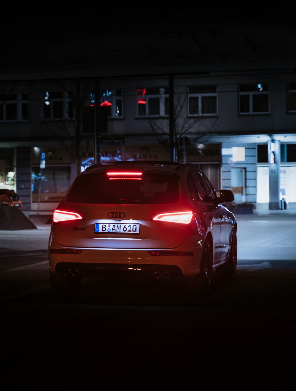 red honda car on road during night time