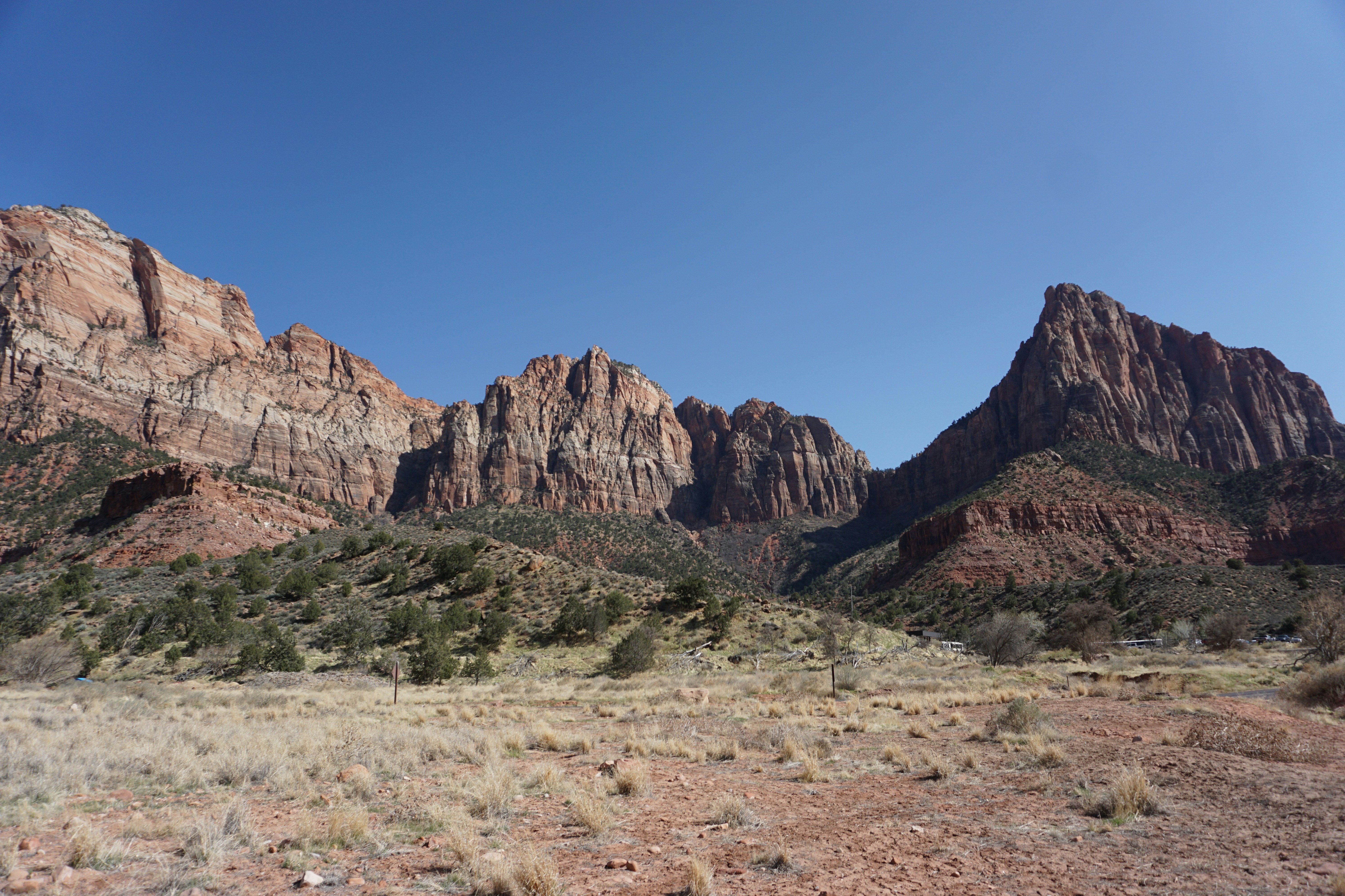 brown rocky mountain under blue sky during daytime