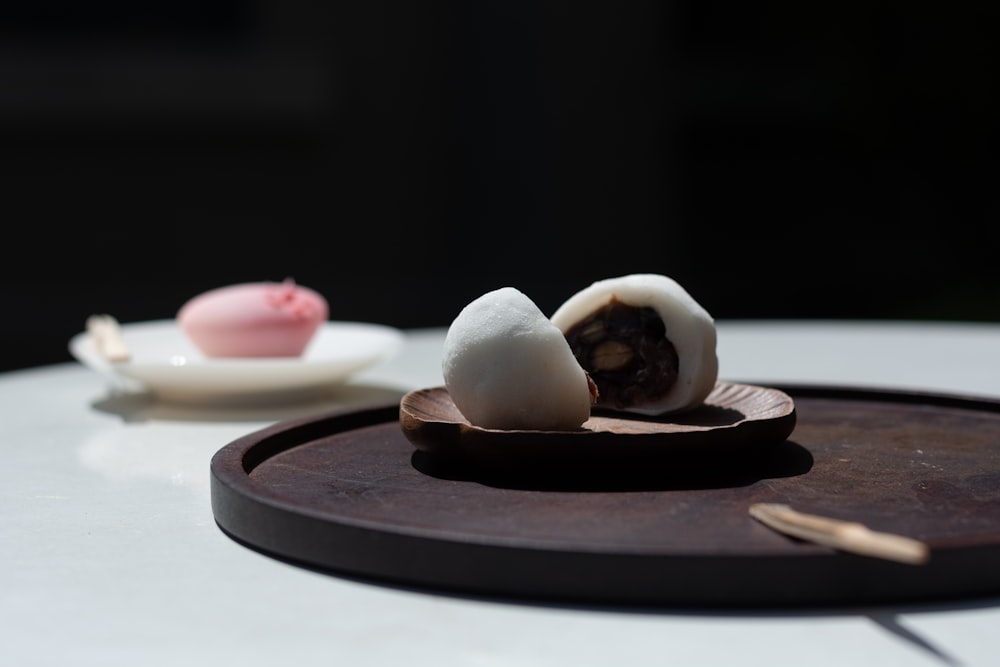 white and brown egg on brown wooden round plate