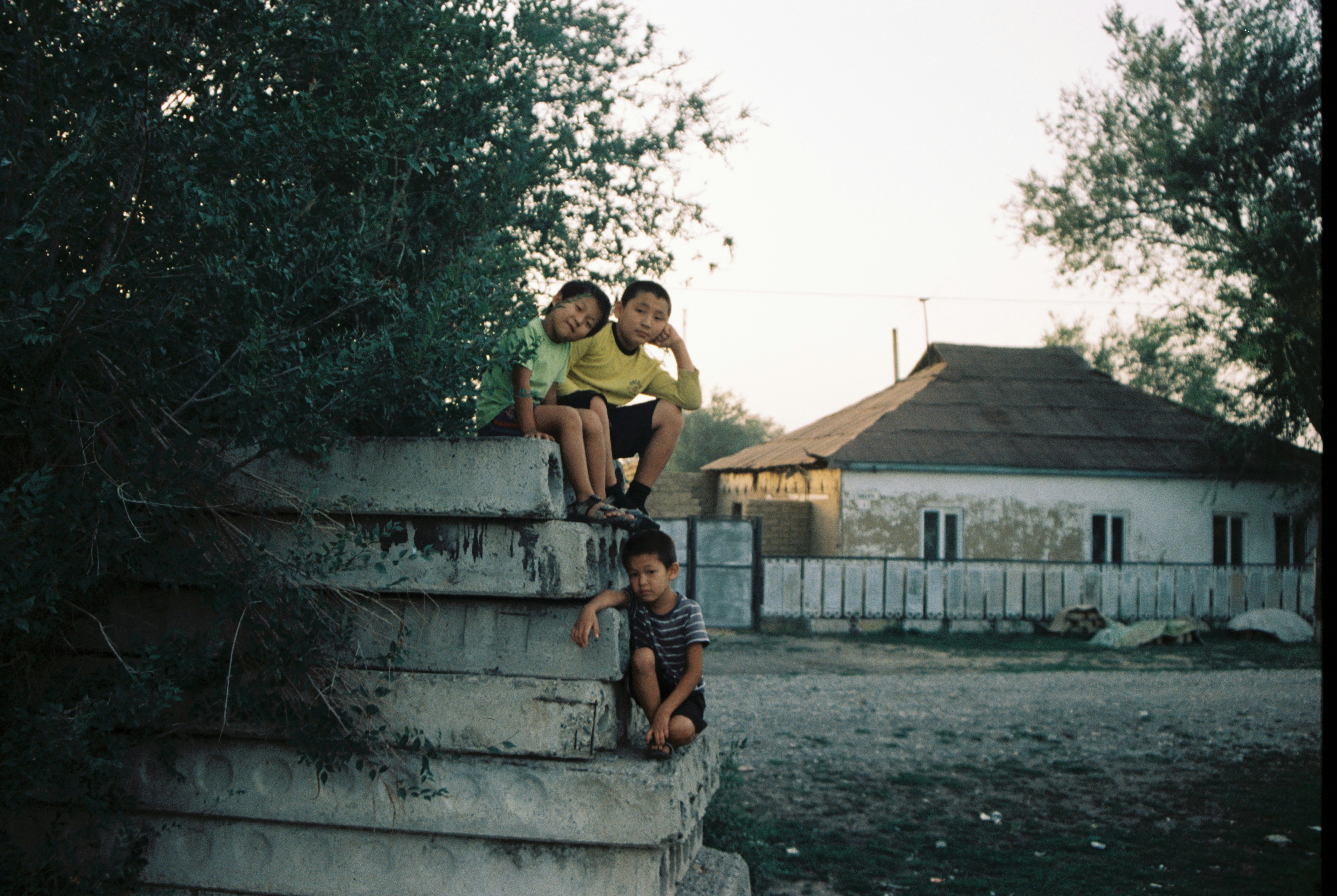 man and woman sitting on concrete stairs