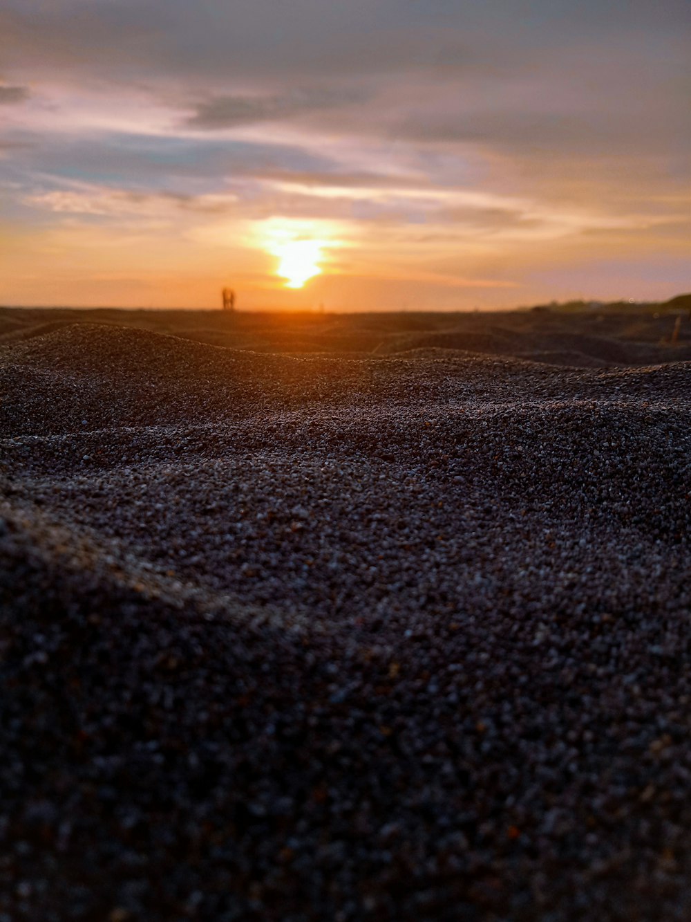 black sand during sunset photo