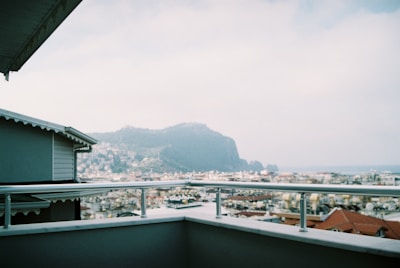 A scenic view of a mountain landscape from a balcony.