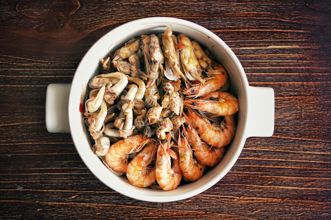 brown and white fried shrimps in white ceramic bowl