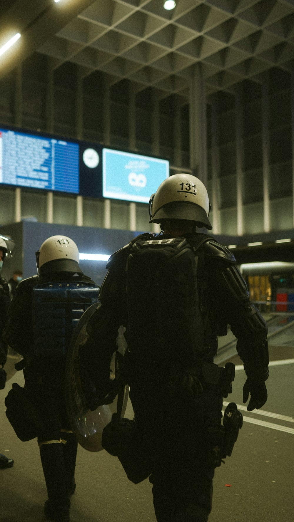 police officer in black jacket and white helmet