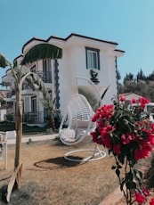 white outdoor fan on brown wooden stand