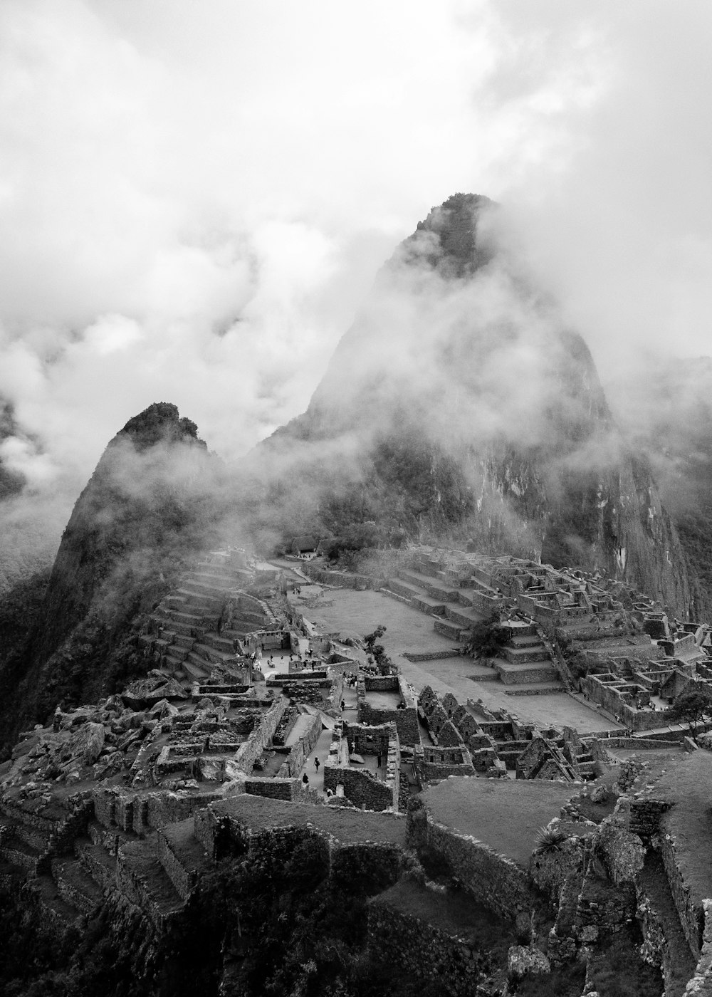 grayscale photo of mountain with smoke