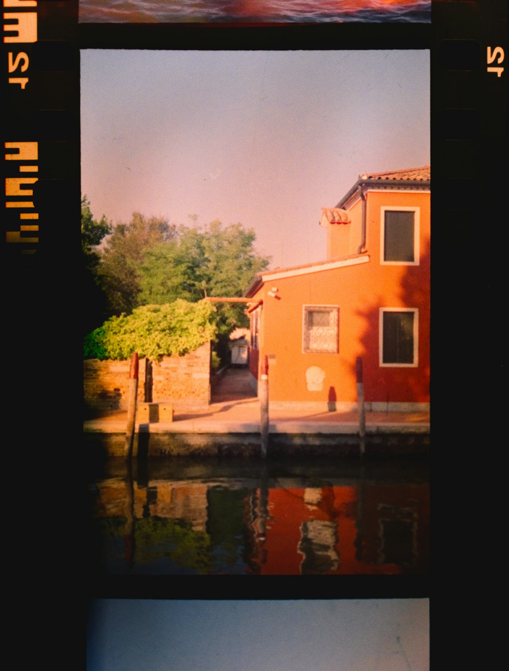 brown concrete building near river during daytime