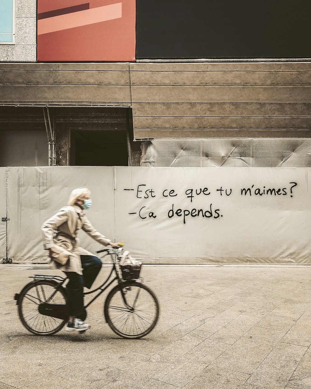 man in white shirt riding on bicycle