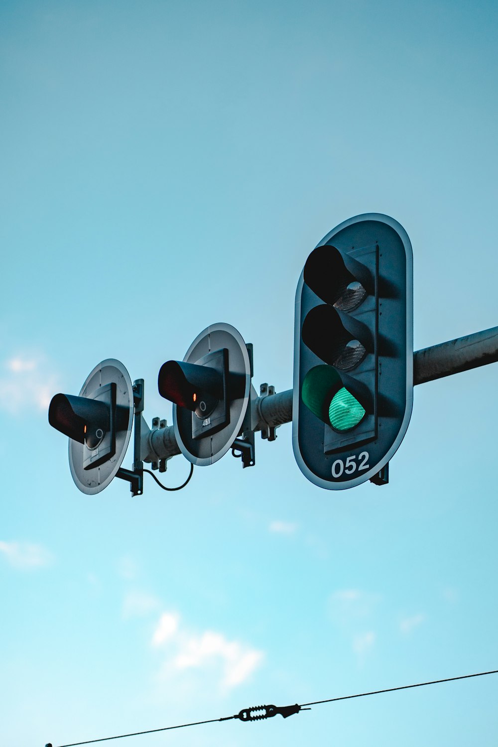 black traffic light under blue sky during daytime